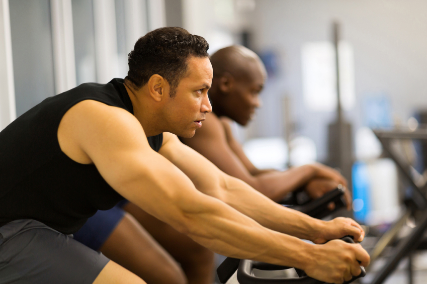 men working out with stationary bike